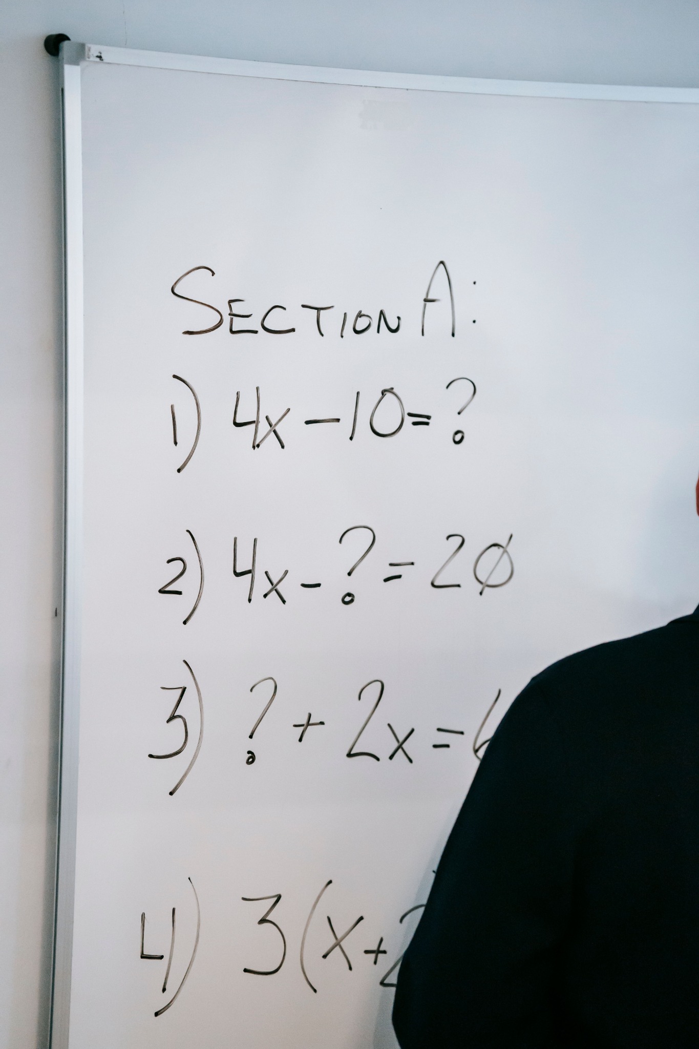 High school algebra written on a whiteboard